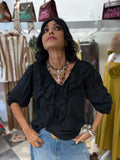 Blusa con volant e maniche a sbuffo