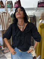 Blusa con volant e maniche a sbuffo