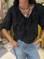 Blusa con volant e maniche a sbuffo