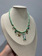 Collana turchese con charm lisca di pesce